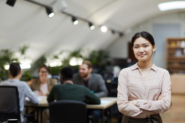 Asian Businesswoman Posing in Office