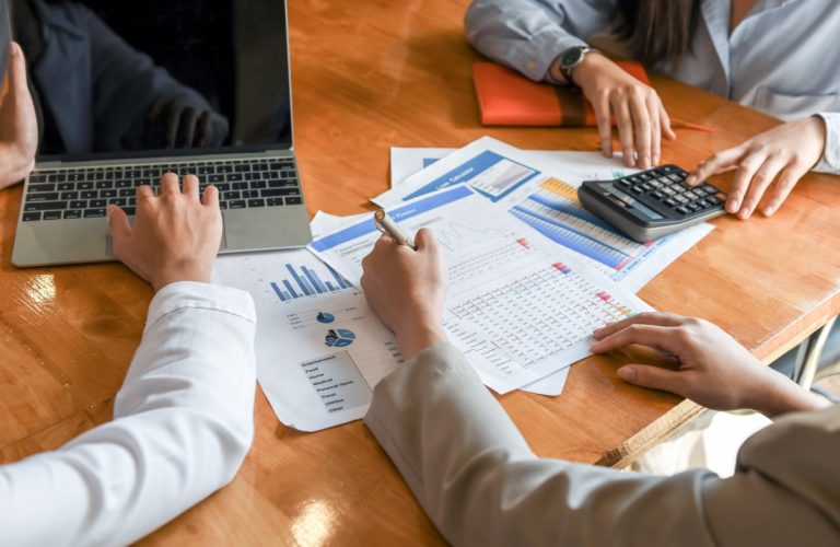 Female accountant team is analyzing data to present the client.